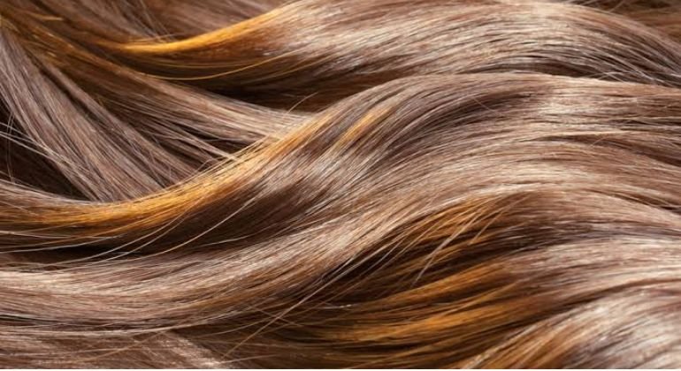 The lipid layer survives, so the hair keeps sliding